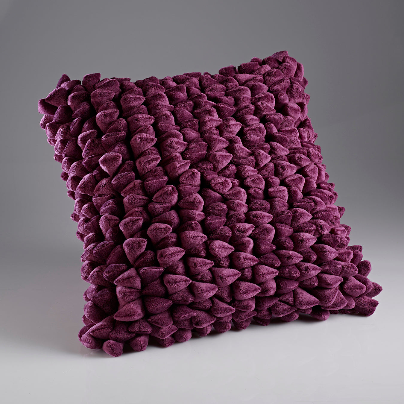 deep magenta textured decorative throw cushion